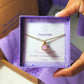 Purple jade square stone necklace jewelry box held in hand showing handmade gold wire wrapped healing crystal gift set, Sri Lankan artisan crown chakra pendant featuring natural square purple gemstone perfect as wisdom jewelry gift for spiritual growth and meditation with elegant presentation