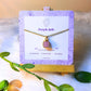  Handmade purple jade square stone necklace in gold wire wrapped design on jewelry card featuring natural healing crystal jewelry crafted by Sri Lankan artisans as crown chakra balancing pendant and wisdom enhancement amulet for women seeking spiritual growth and inner peace with geometric purple gemstone