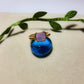 Natural purple jade square stone ring on aesthetic background showing handmade gold wire wrapped healing crystal jewelry, Sri Lankan artisan crown chakra ring featuring geometric purple gemstone perfect as boho wisdom ring and spiritual amulet for meditation and tranquility