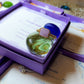 Handmade purple jade square stone ring in elegant jewelry box showing gold wire wrapped healing crystal gift set, Sri Lankan artisan crown chakra ring featuring natural square purple gemstone perfect as wisdom jewelry gift for spiritual growth and meditation with premium packaging