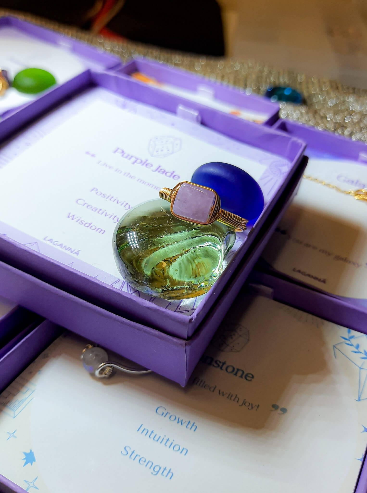 Handmade purple jade square stone ring in elegant jewelry box showing gold wire wrapped healing crystal gift set, Sri Lankan artisan crown chakra ring featuring natural square purple gemstone perfect as wisdom jewelry gift for spiritual growth and meditation with premium packaging