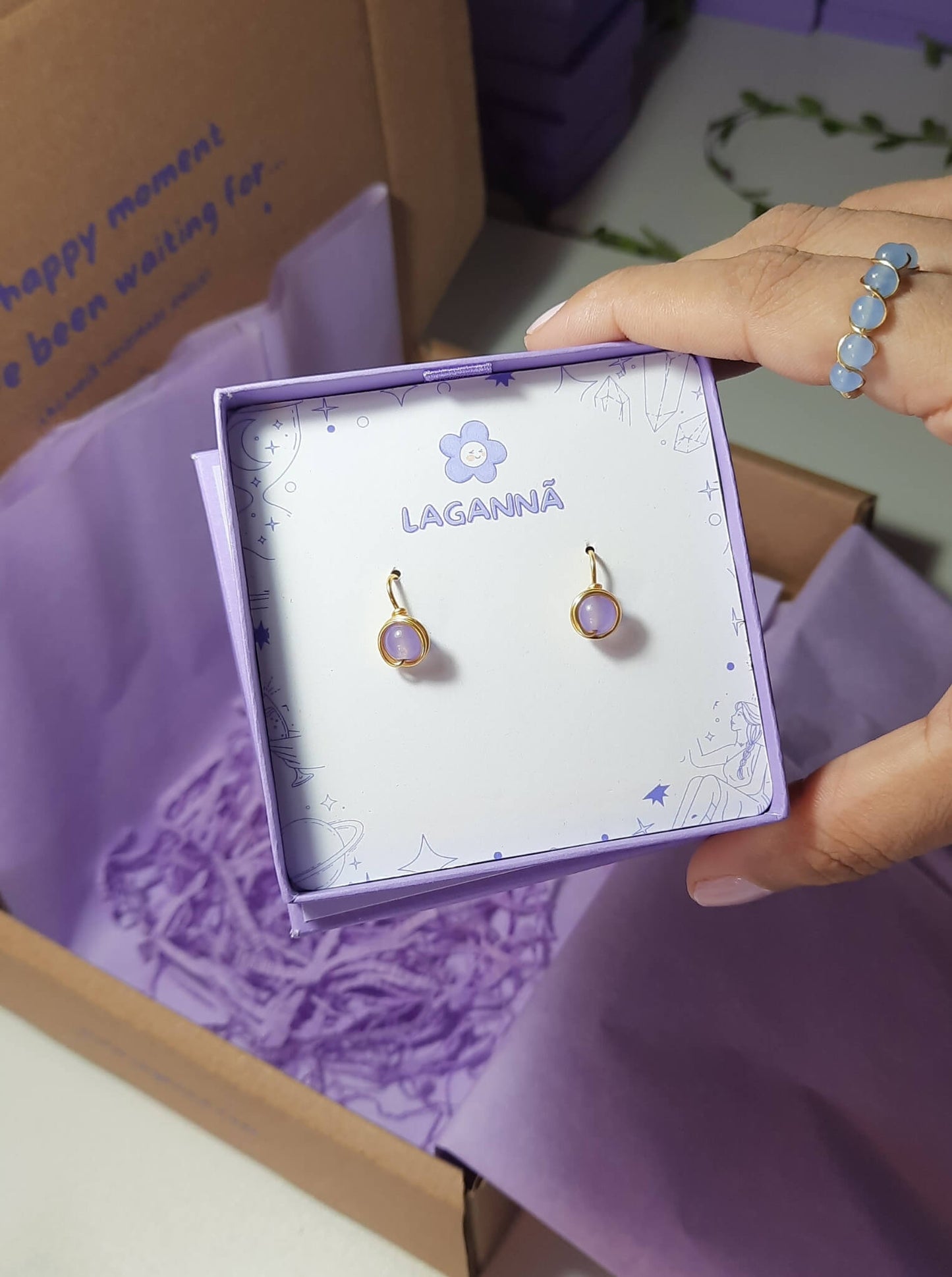 Purple Jade Petite Round Stud Earrings packaging with crystal meaning card - handcrafted wire-wrapped healing jewelry gift from Sri Lanka featuring natural purple jade stone for positivity, creativity, and wisdom