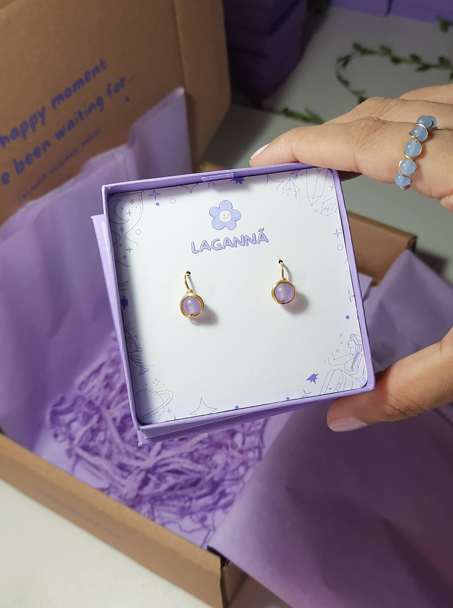 Purple Jade Petite Round Stud Earrings packaging with crystal meaning card - handcrafted wire-wrapped healing jewelry gift from Sri Lanka featuring natural purple jade stone for positivity, creativity, and wisdom