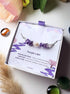 Purple Lake Bracelet amethyst freshwater pearl purple jade silver wire wrapped in Laganna jewelry box overhead flat lay with pampas grass styling, handmade healing crystal bracelet Sri Lanka – purity inner peace emotional healing
