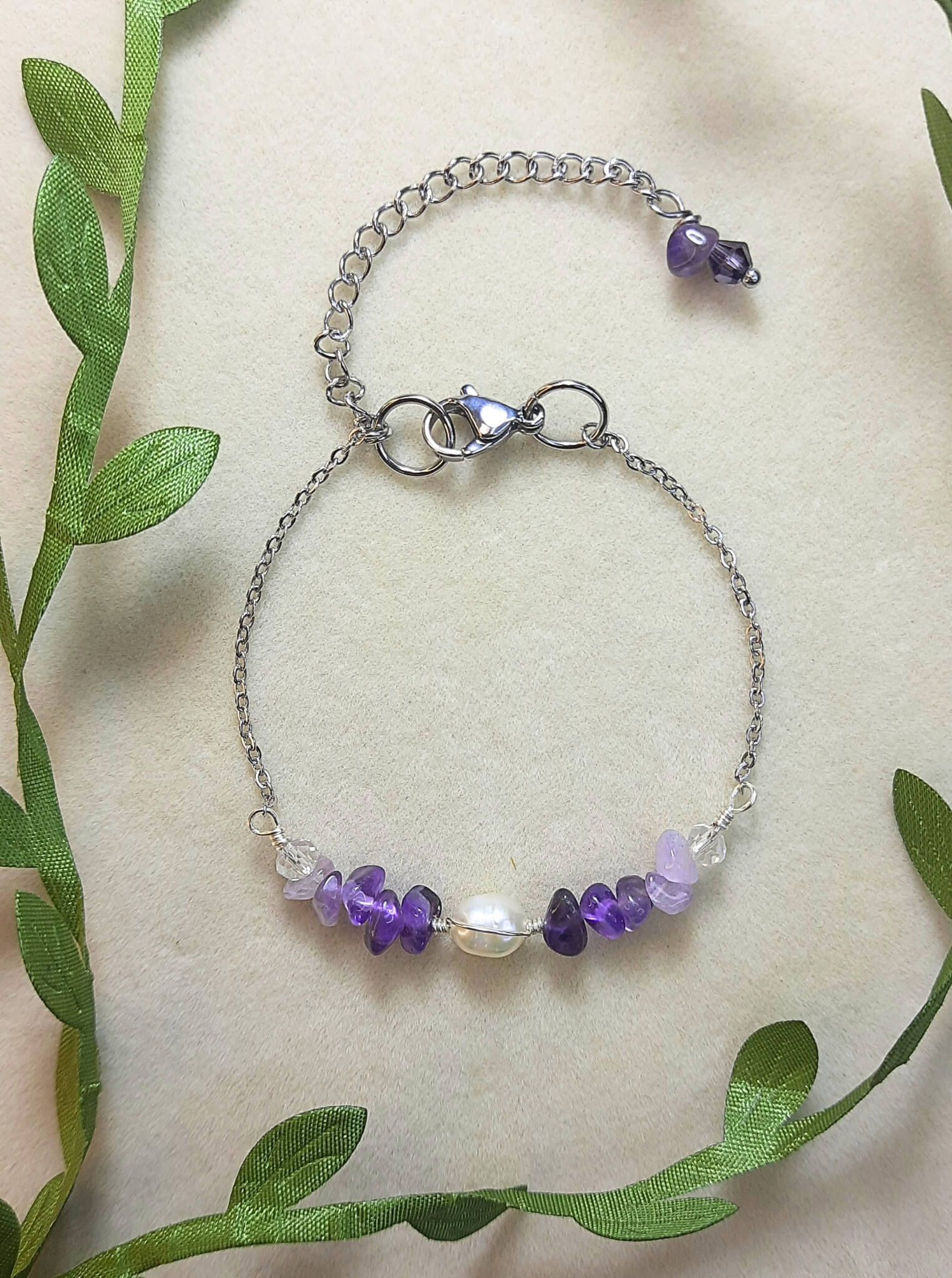 Purple Lake Bracelet in silver wire wrap featuring amethyst and purple crystals with water-inspired palette, handmade jewelry from Sri Lanka