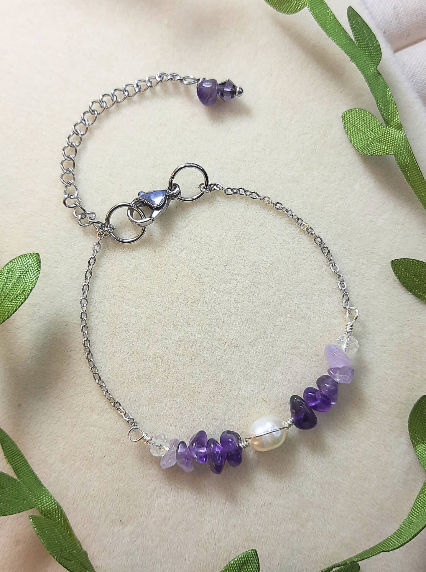 Side view of Purple Lake Bracelet showing silver wire wrapped purple crystals and amethyst stones in serene lake-inspired design, handmade in Sri Lanka