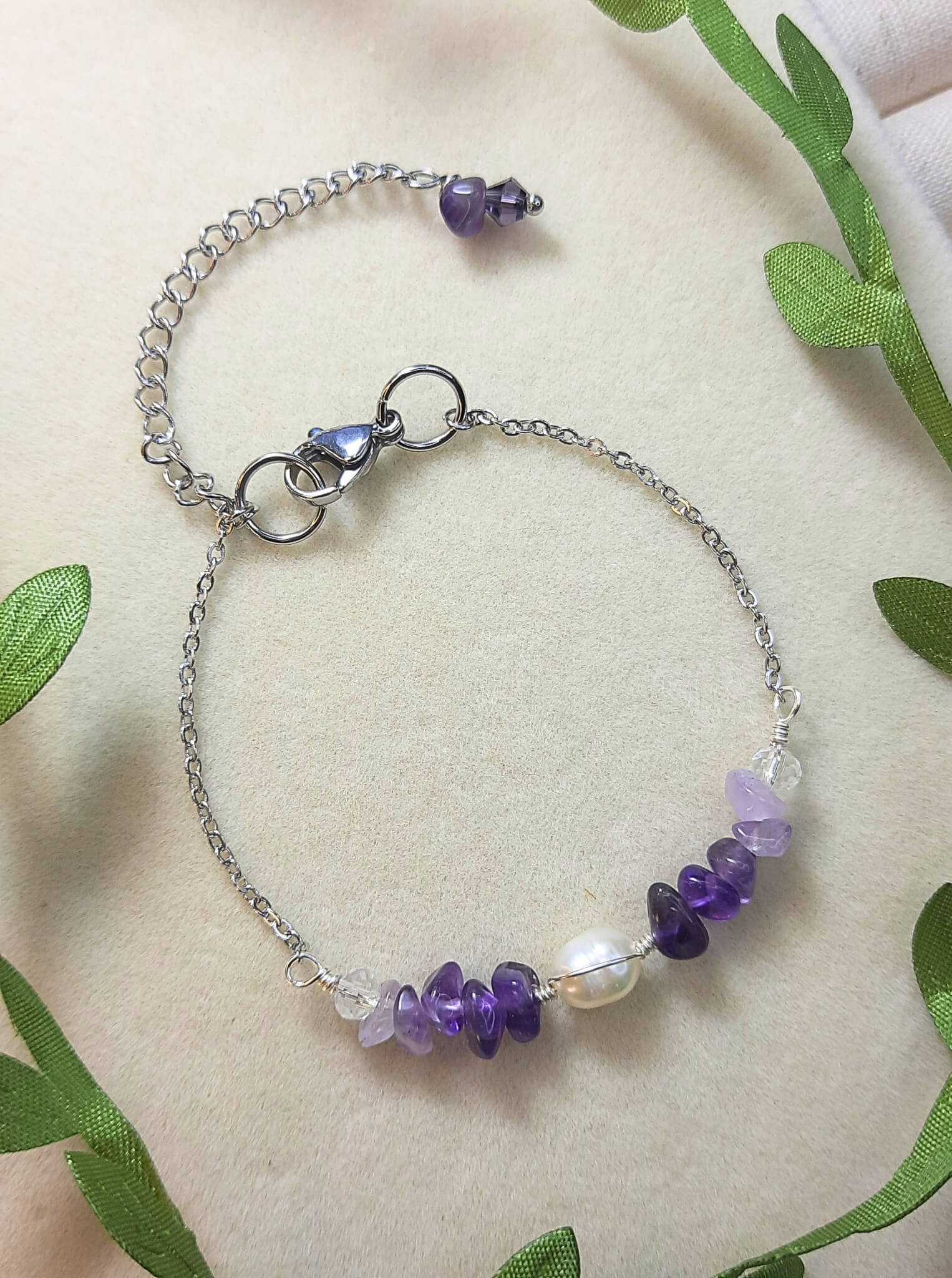Side view of Purple Lake Bracelet showing silver wire wrapped purple crystals and amethyst stones in serene lake-inspired design, handmade in Sri Lanka