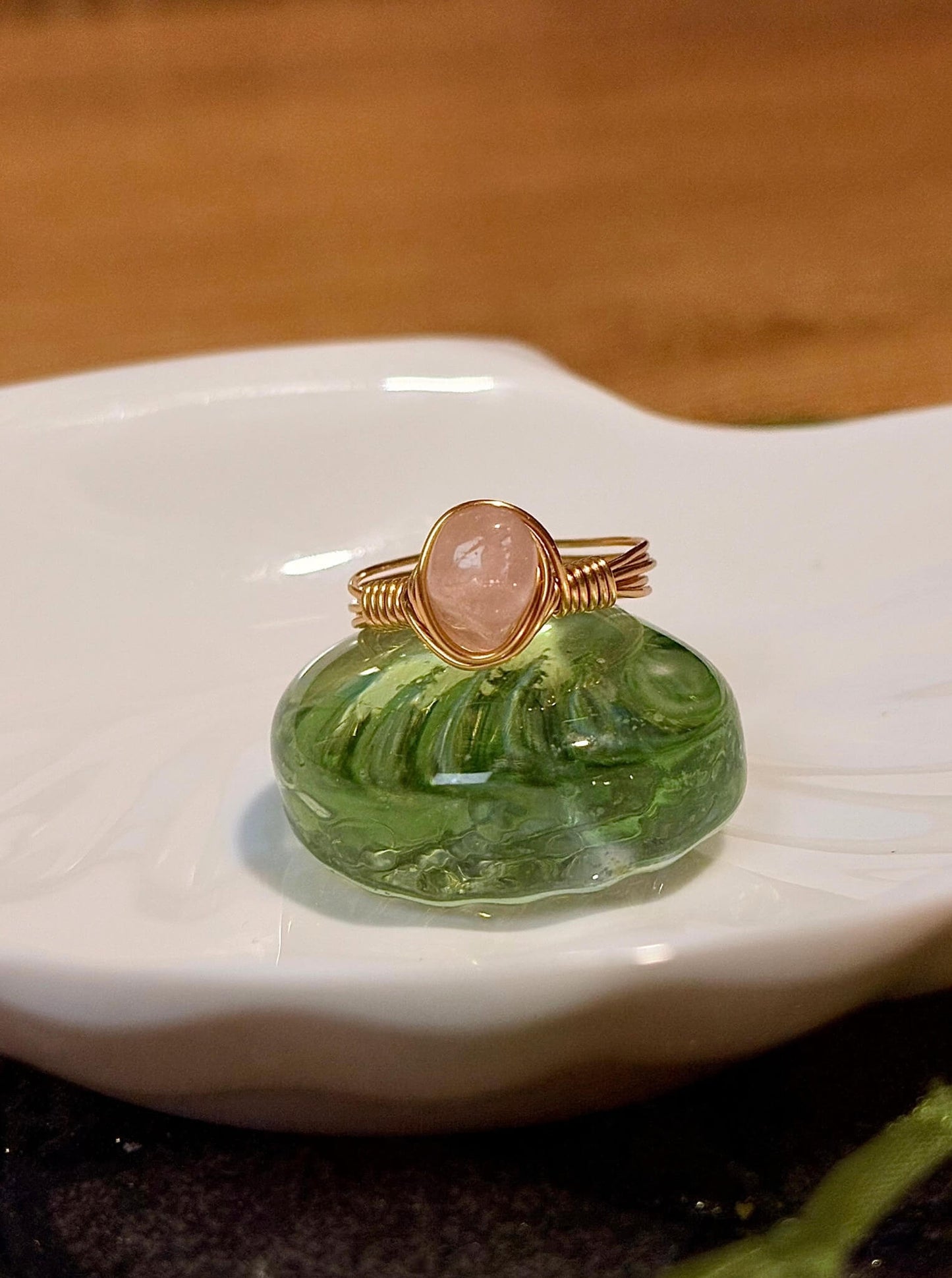 Rose quartz irregular stone ring with natural tumbled pink gemstone showing handmade gold wire wrapped healing crystal jewelry, Sri Lankan spiritual ring featuring raw rose quartz perfect as boho love stone ring and heart chakra amulet for nature-loving metaphysical jewelry enthusiasts
