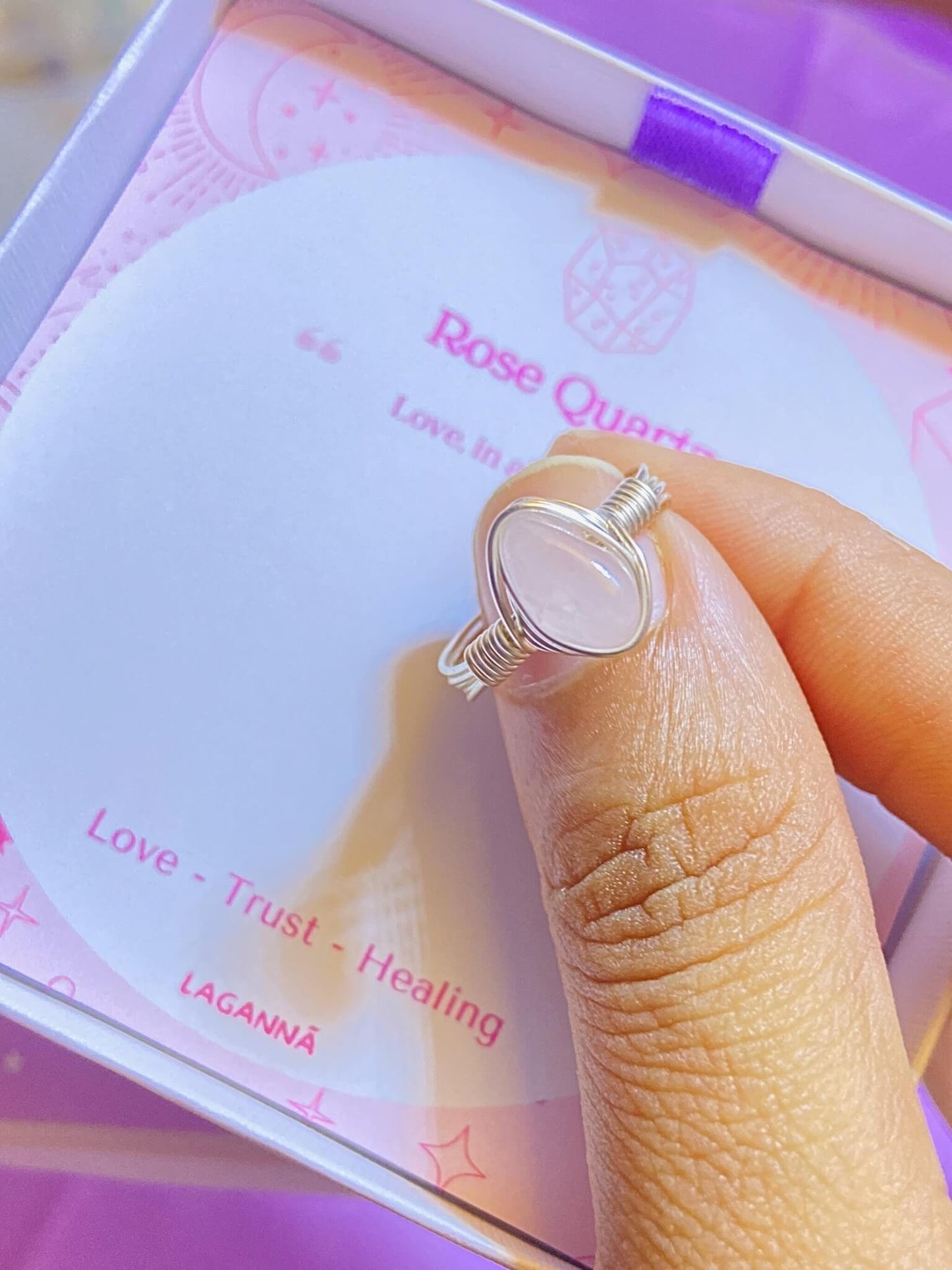  Rose quartz irregular stone ring worn on hand showing handmade silver wire wrapped healing crystal jewelry lifestyle, Sri Lankan spiritual love stone ring featuring natural pink gemstone perfect as boho heart chakra ring and protective amulet for self-love and emotional healing daily wear