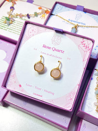 Rose Quartz Statement Round Stud Earrings packaging with crystal meaning card - handcrafted wire-wrapped healing jewelry gift from Sri Lanka featuring natural rose quartz stone for love, tenderness, and compassion
