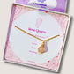 Beautiful rose quartz round pendant necklace on clean white background with jewelry box, featuring delicate gold wire wrapping - artisan-crafted healing crystal jewelry handmade in Sri Lanka for self-love and acceptance