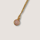 Elegant rose quartz round stone pendant necklace on white background, showcasing minimalist gold wire wrapped design - handmade healing crystal jewelry from Sri Lanka for love energy and emotional wellness