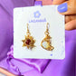 Sun & Moon Dangle Earrings with Carnelian and Opalite healing crystals, handmade gold wire wrapped celestial jewelry from Sri Lanka by Laganna, displayed with jewelry card