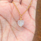 Handmade sweet heart rose quartz necklace held in hand showing gold wire wrapped healing crystal jewelry lifestyle, Sri Lankan artisan heart chakra pendant featuring natural heart-shaped pink gemstone perfect as boho love necklace and self-love amulet for emotional healing and compassion