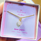 Sweet heart rose quartz necklace jewelry box held in hand showing handmade gold wire wrapped healing crystal gift set, Sri Lankan artisan heart chakra pendant featuring natural heart-shaped pink gemstone perfect as love jewelry gift for self-love and emotional healing with elegant presentation