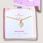 Handmade sweet heart rose quartz necklace in gold wire wrapped design in elegant jewelry box featuring natural healing crystal jewelry crafted by Sri Lankan artisans as heart chakra balancing pendant and self-love enhancement amulet for women seeking emotional healing with heart-shaped pink gemstone
