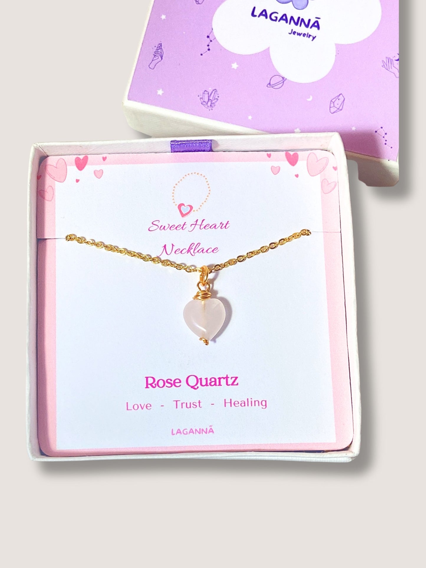 Handmade sweet heart rose quartz necklace in gold wire wrapped design in elegant jewelry box featuring natural healing crystal jewelry crafted by Sri Lankan artisans as heart chakra balancing pendant and self-love enhancement amulet for women seeking emotional healing with heart-shaped pink gemstone