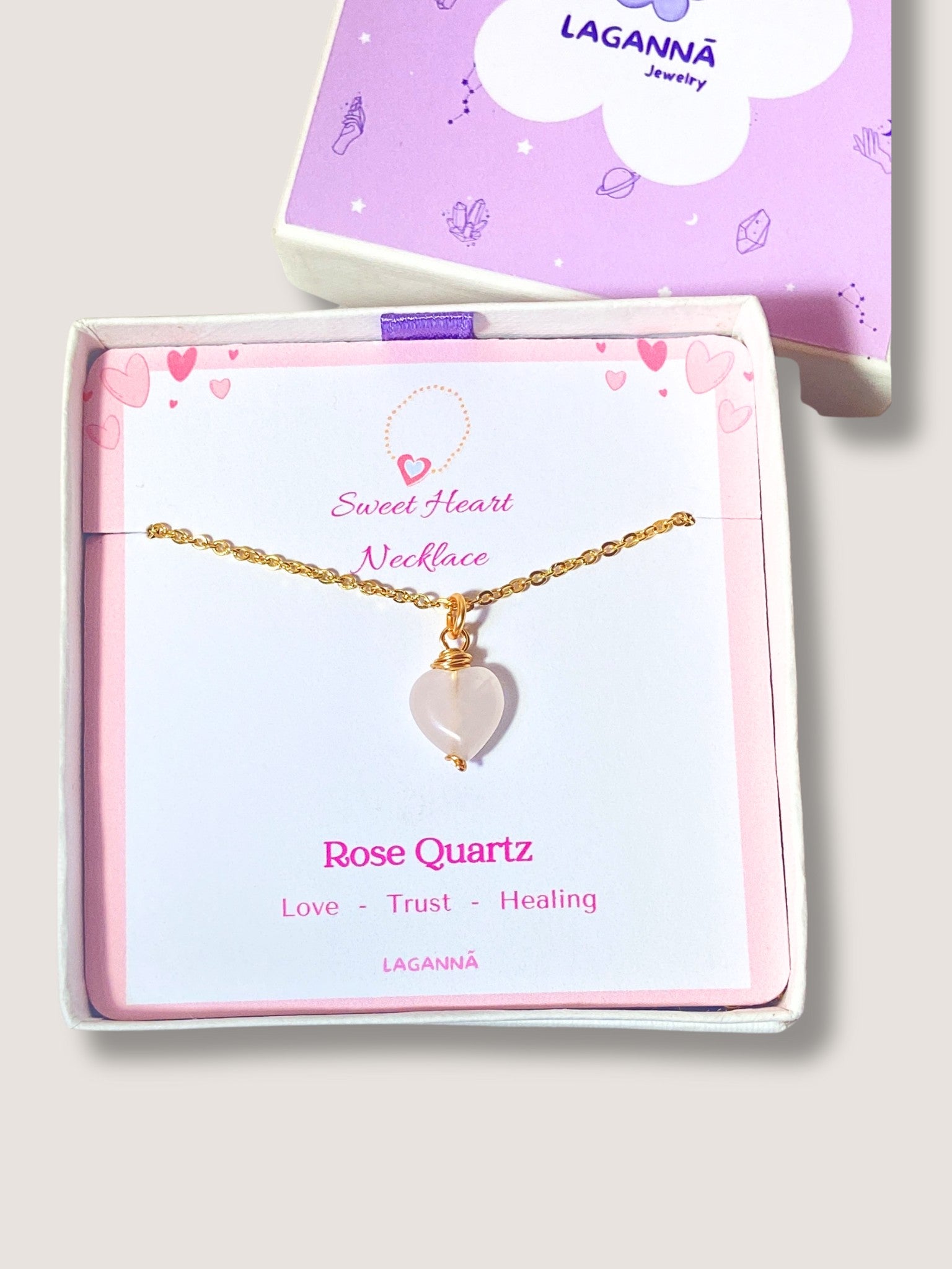 Handmade sweet heart rose quartz necklace in gold wire wrapped design in elegant jewelry box featuring natural healing crystal jewelry crafted by Sri Lankan artisans as heart chakra balancing pendant and self-love enhancement amulet for women seeking emotional healing with heart-shaped pink gemstone