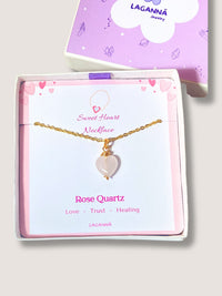 Handmade sweet heart rose quartz necklace in gold wire wrapped design in elegant jewelry box featuring natural healing crystal jewelry crafted by Sri Lankan artisans as heart chakra balancing pendant and self-love enhancement amulet for women seeking emotional healing with heart-shaped pink gemstone
