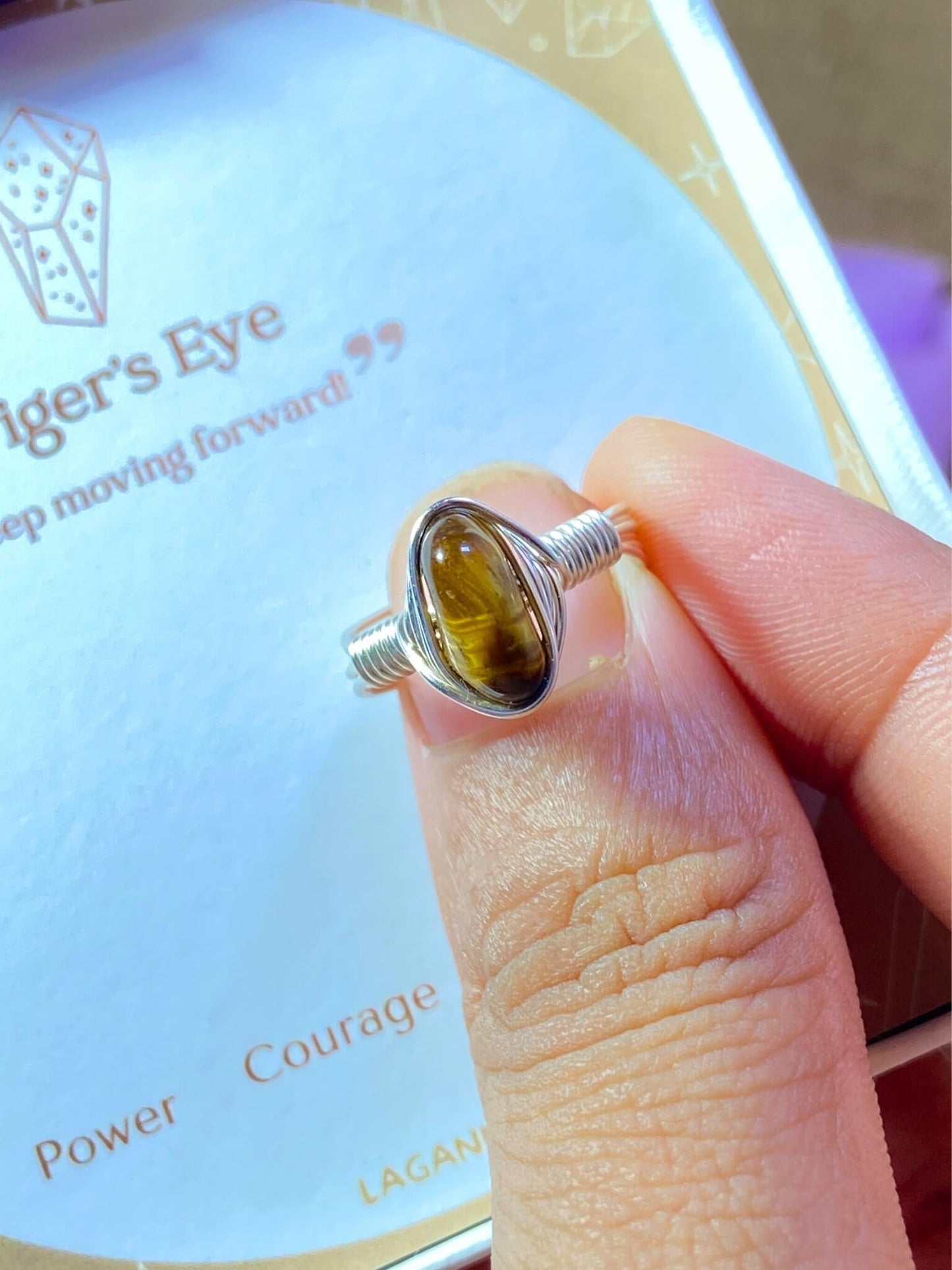 Tiger's eye irregular stone ring jewelry box held in hand showing handmade silver wire wrapped healing crystal gift set, Sri Lankan artisan courage stone ring featuring natural golden brown gemstone perfect as confidence jewelry gift for protection and grounding energy
