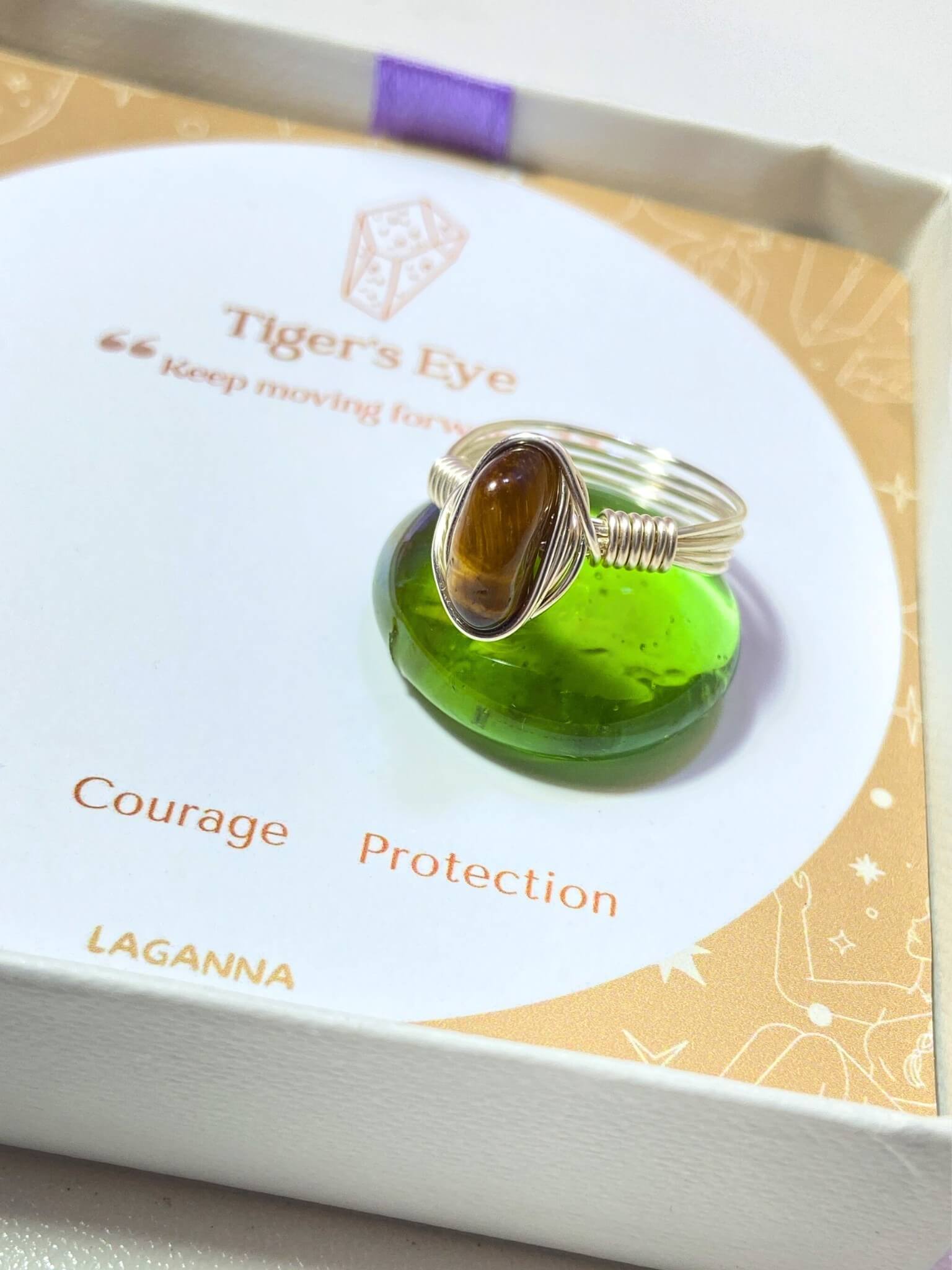 Tiger's eye irregular stone ring in elegant jewelry box side view showing handmade silver wire wrapped healing crystal gift set, Sri Lankan artisan courage stone ring featuring natural golden brown gemstone perfect as solar plexus chakra jewelry gift for confidence and protection with premium packaging