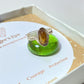 Handmade tiger's eye irregular stone ring in silver wire wrapped design on jewelry box featuring natural healing crystal jewelry crafted by Sri Lankan artisans as courage stone ring and solar plexus chakra balancing amulet for women seeking confidence and protection with raw golden brown gemstone energy