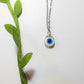 Laganna handmade white evil eye silver necklace for protection on light background